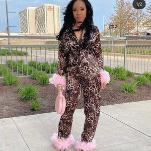 SOLD! leopard two piece with pink fur. worn once!